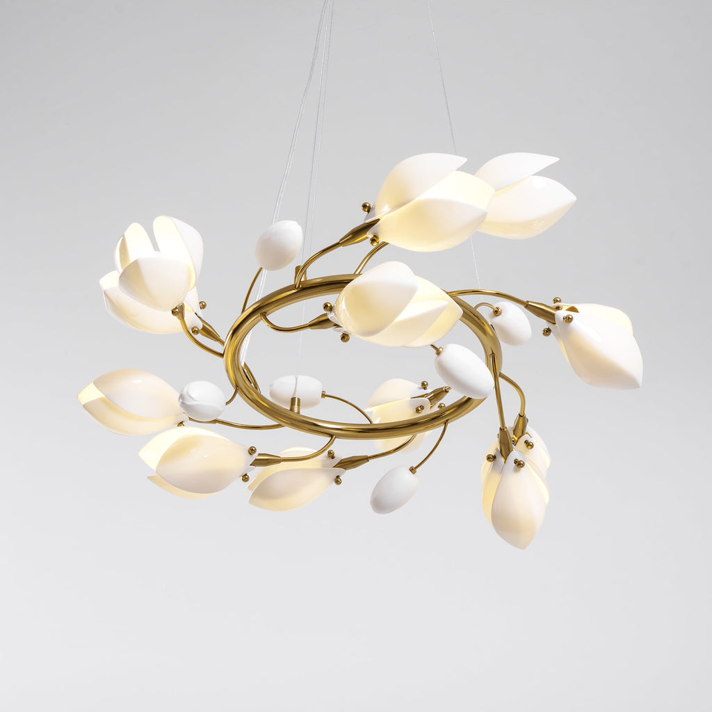 Clérachic chandelier on a grey backdrop, seen from slightly below, with white petals and small bud shades on twisting gold branches.