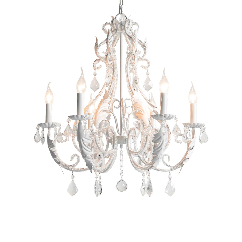 A lit white Clérachic chandelier with candle bulbs, scrolling arms and clear crystal drops, on a white background.