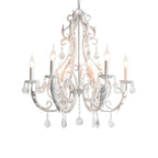 A lit white Clérachic chandelier with candle bulbs, scrolling arms and clear crystal drops, on a white background.
