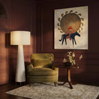 Clérachic tall white drum shade floor lamp beside an olive velvet armchair, in a room with deep plum panelled walls.
