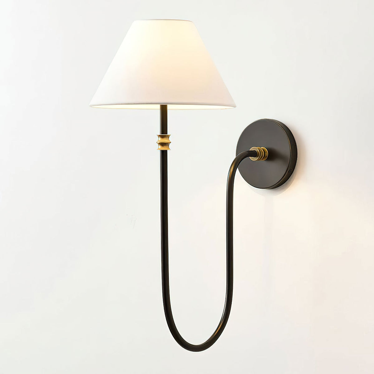 Black Clérachic wall light mirrored to the left, with the white shade at the left and the round backplate at the right.