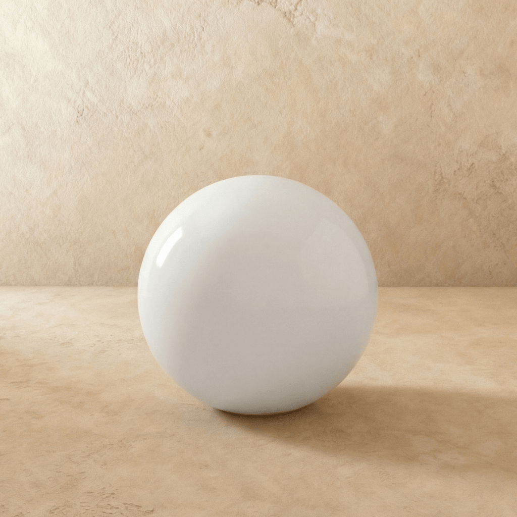This oversized Clérachic sphere floor lamp sits unlit, its glossy surface catching soft studio light.