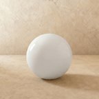 This oversized Clérachic sphere floor lamp sits unlit, its glossy surface catching soft studio light.