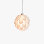 Clérachic White Flower Pendant Light, layered white petals forming a glowing globe on a thin grey cord.