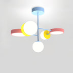 Close view from below of this Clérachic chandelier, showing its pale blue stem, pink and yellow discs and frosted white globes on a grey backdrop.