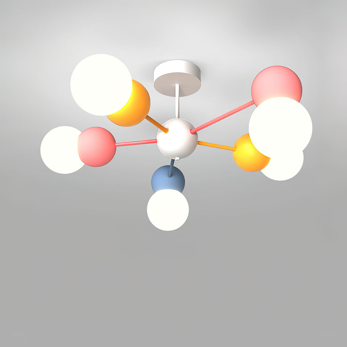 Top-down view of a Clérachic chandelier with a white canopy, thin pink and orange arms and white globes in pink, orange and blue holders.