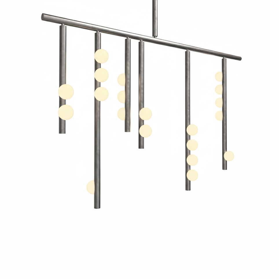Close view of the nickel-toned bar and drop rods on this Clérachic chandelier, with white orbs lit warm.
