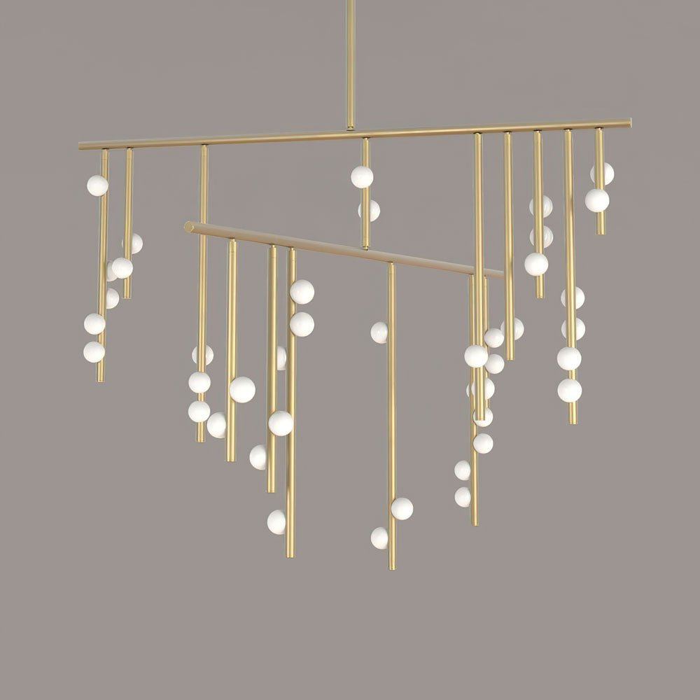 Close view of this Clérachic chandelier in brass, with two long bars and white orbs spaced along the hanging rods.