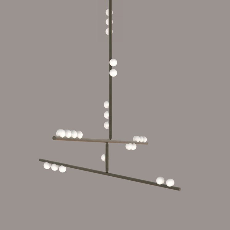 This Clérachic pendant in a pale nickel-toned finish on a taupe backdrop, with white orbs on the rod and bars.