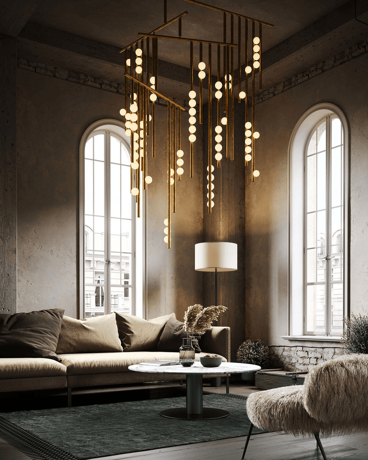 A Clérachic chandelier hanging in a grand room with arched windows, its rods and orbs glowing above a low round table.