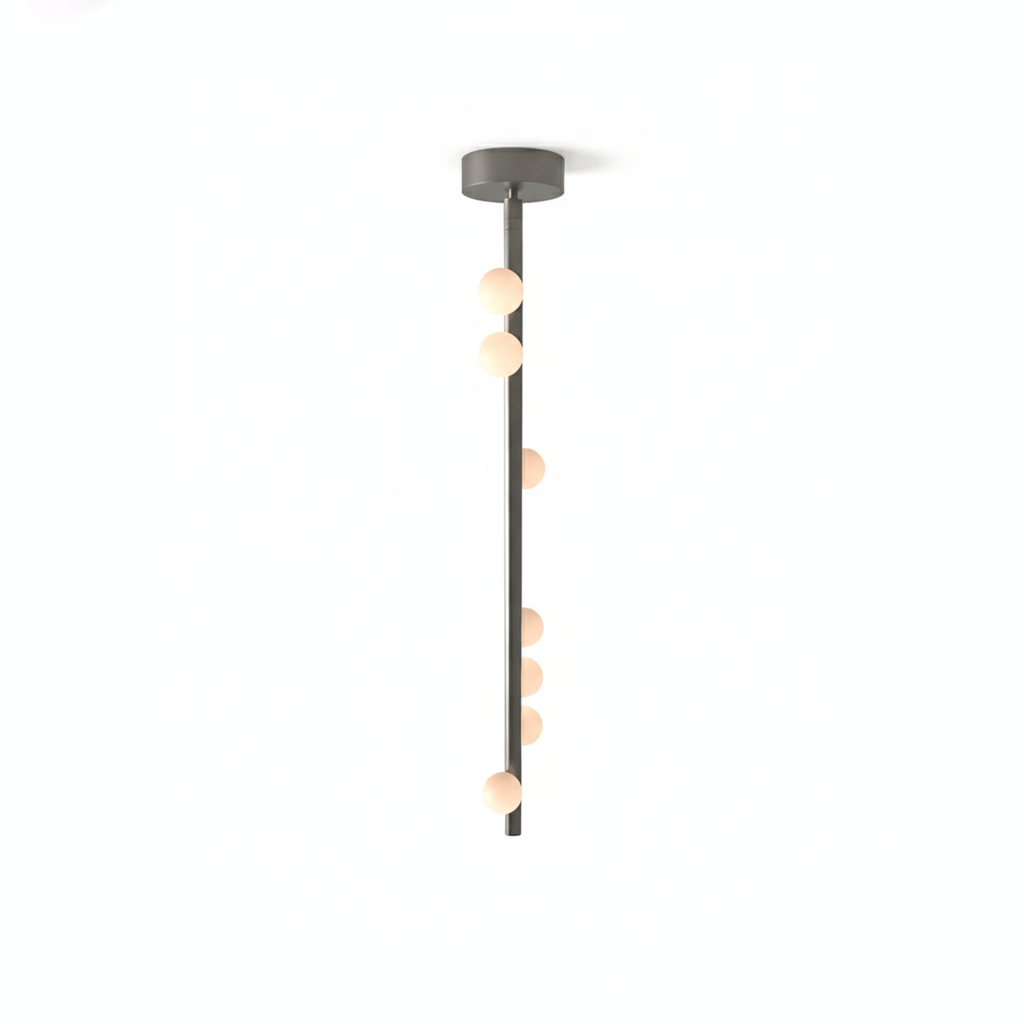 This Clérachic single-rod pendant in a grey metal finish with a round plate, on a white backdrop.