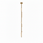 A very long Clérachic single-rod pendant in brass with white orbs spaced down its length, on white.