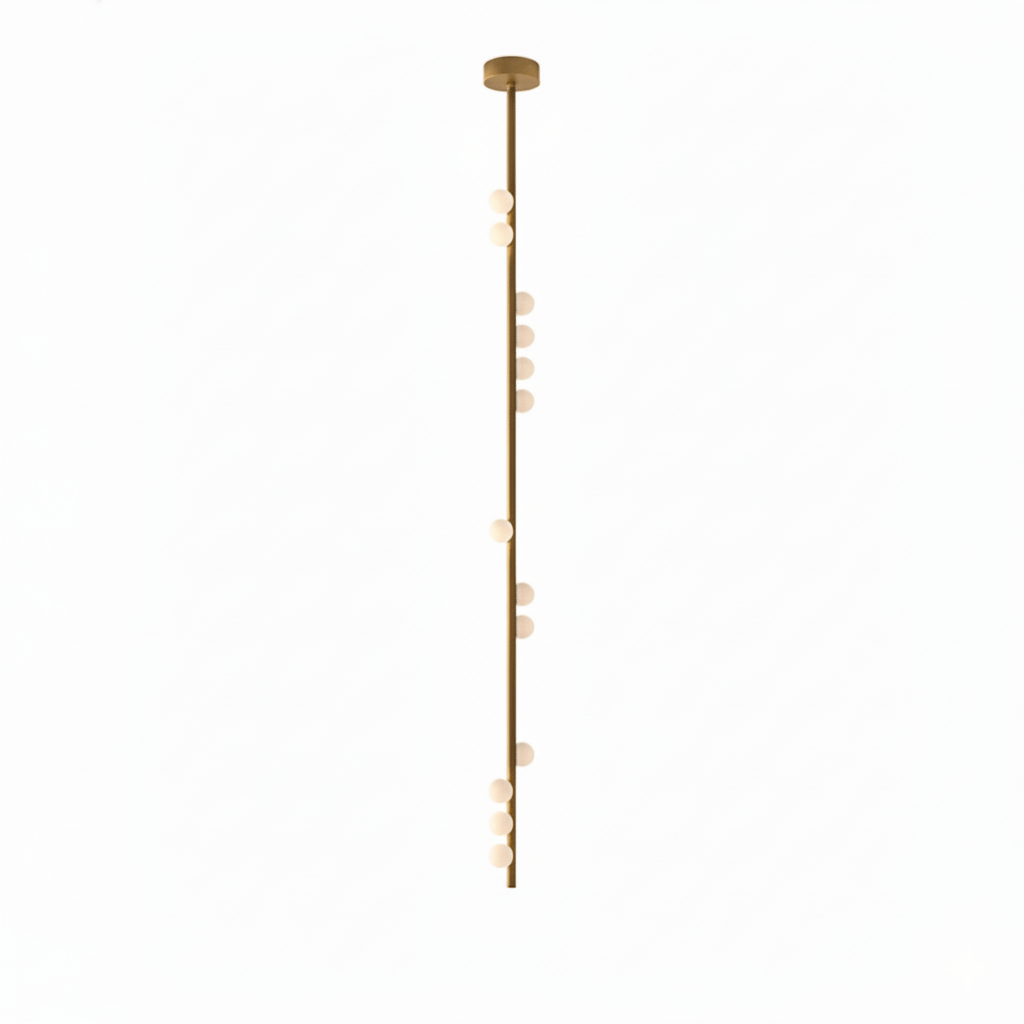 A very long Clérachic single-rod pendant in brass with white orbs spaced down its length, on white.
