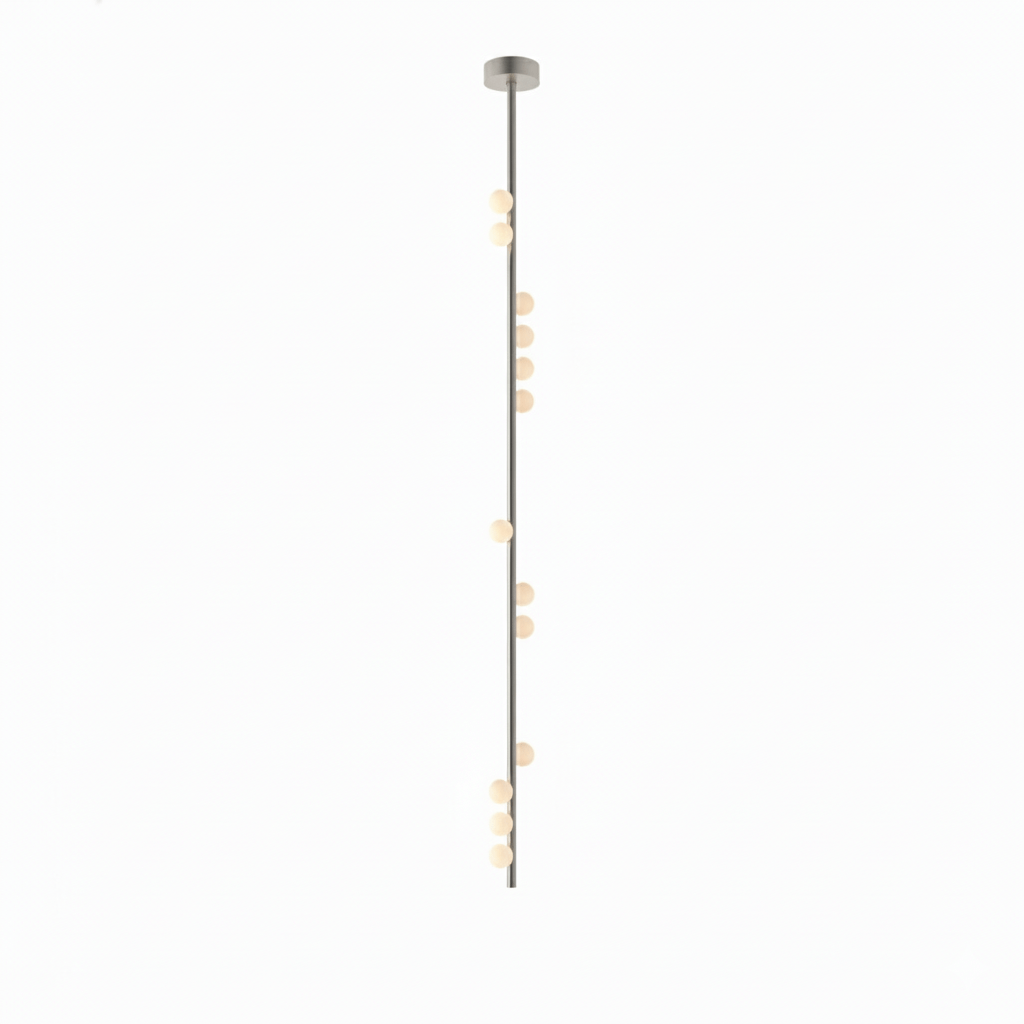 A long Clérachic single-rod pendant in a nickel-toned finish, with a small plate and white orbs along it.