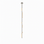 A long Clérachic single-rod pendant in a nickel-toned finish, with a small plate and white orbs along it.