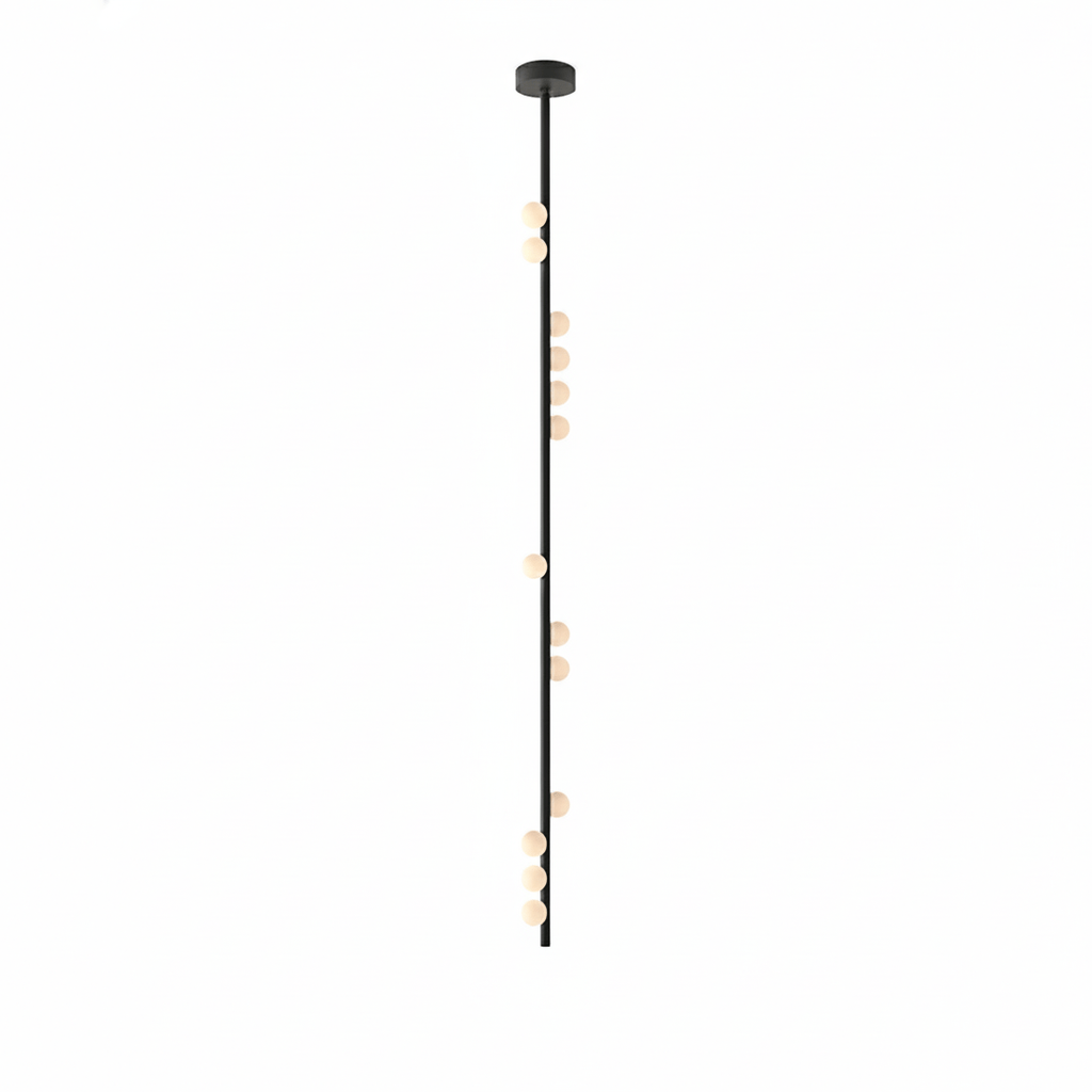 A long black Clérachic single-rod pendant with a small plate and orbs spaced along its length.