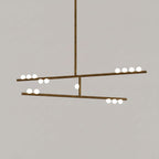 This Clérachic two-bar pendant in antique bronze with white orbs, on a warm taupe backdrop.