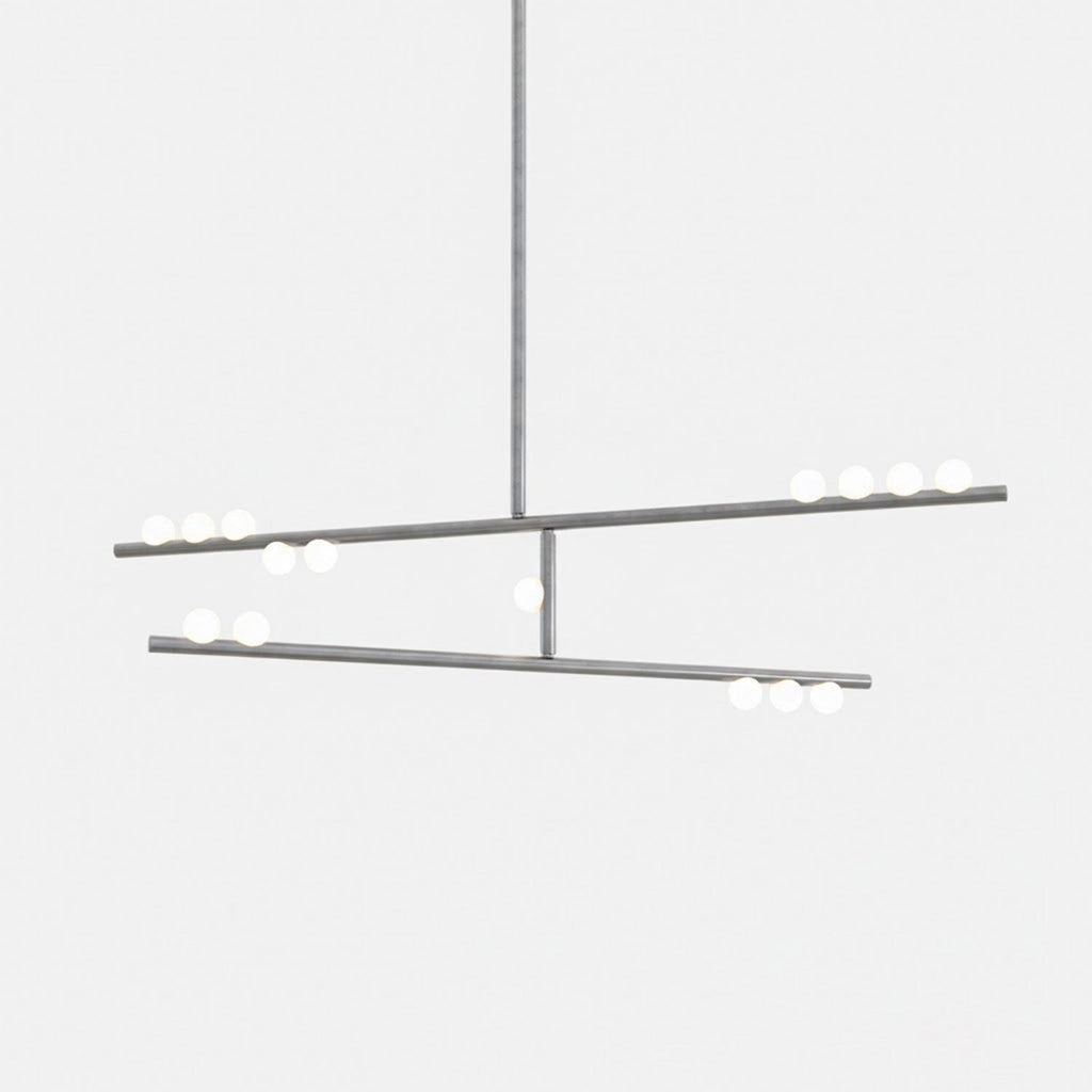 A Clérachic two-bar pendant in a nickel-toned finish with white orbs, on a pale backdrop.