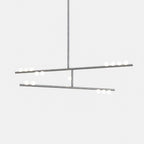 A Clérachic two-bar pendant in a nickel-toned finish with white orbs, on a pale backdrop.