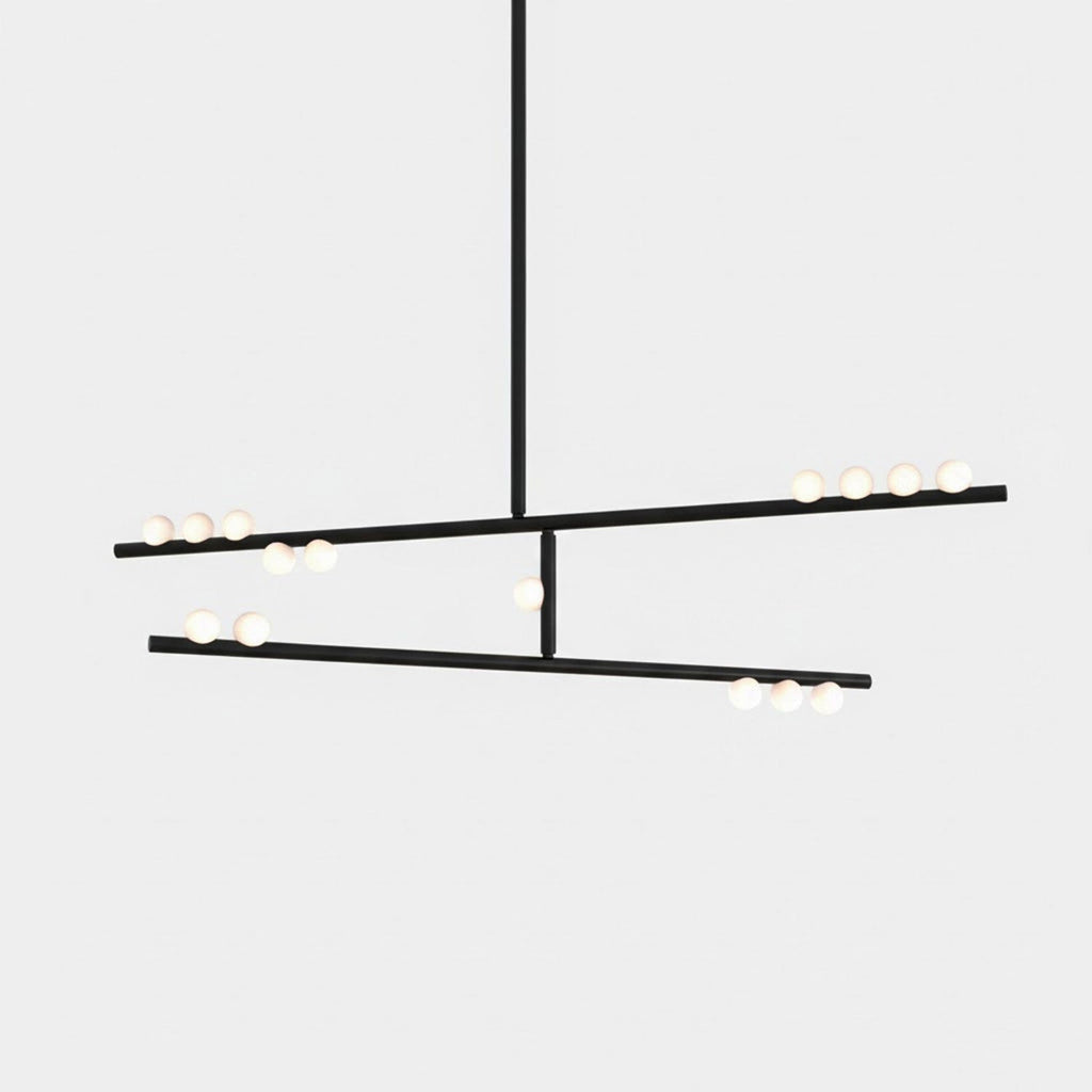 A black Clérachic two-bar pendant with white orbs along each bar, on a pale backdrop.