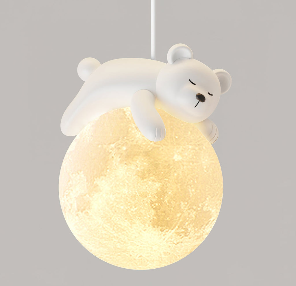 Close view of the sleeping white bear, with its arm over a warm, moon-textured glass globe, on this Clérachic pendant light.