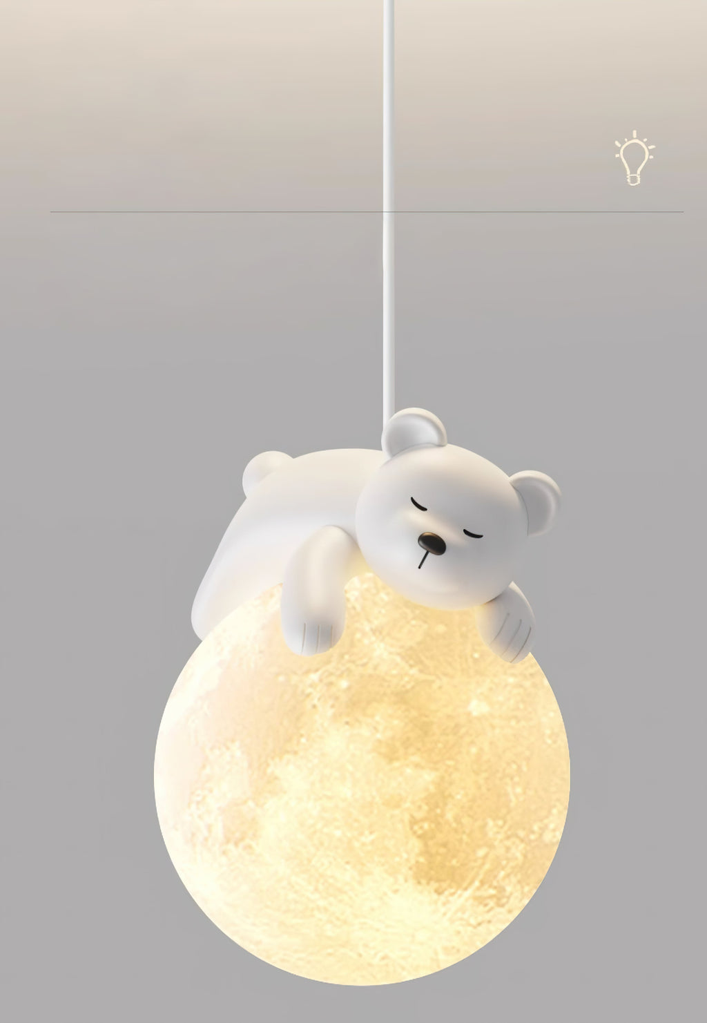 A white bear dozes on top of the cratered, glowing globe of this Clérachic pendant, set on a soft grey backdrop.