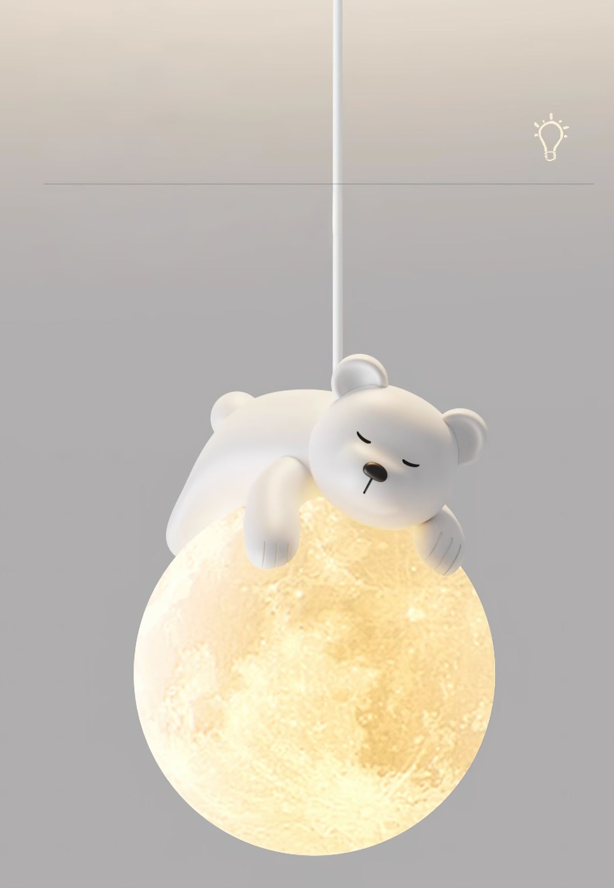 A white bear dozes on top of the cratered, glowing globe of this Clérachic pendant, set on a soft grey backdrop.