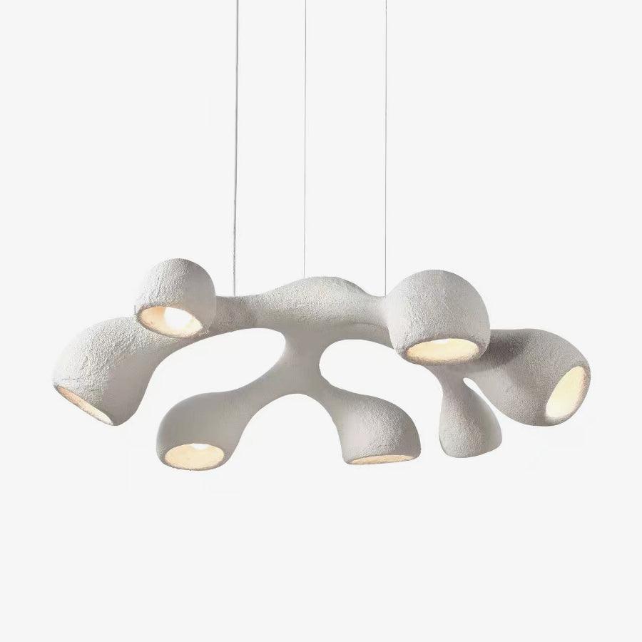 Clérachic pendant on a light backdrop, its white branching arms each ending in a rounded, bulb-lit opening.