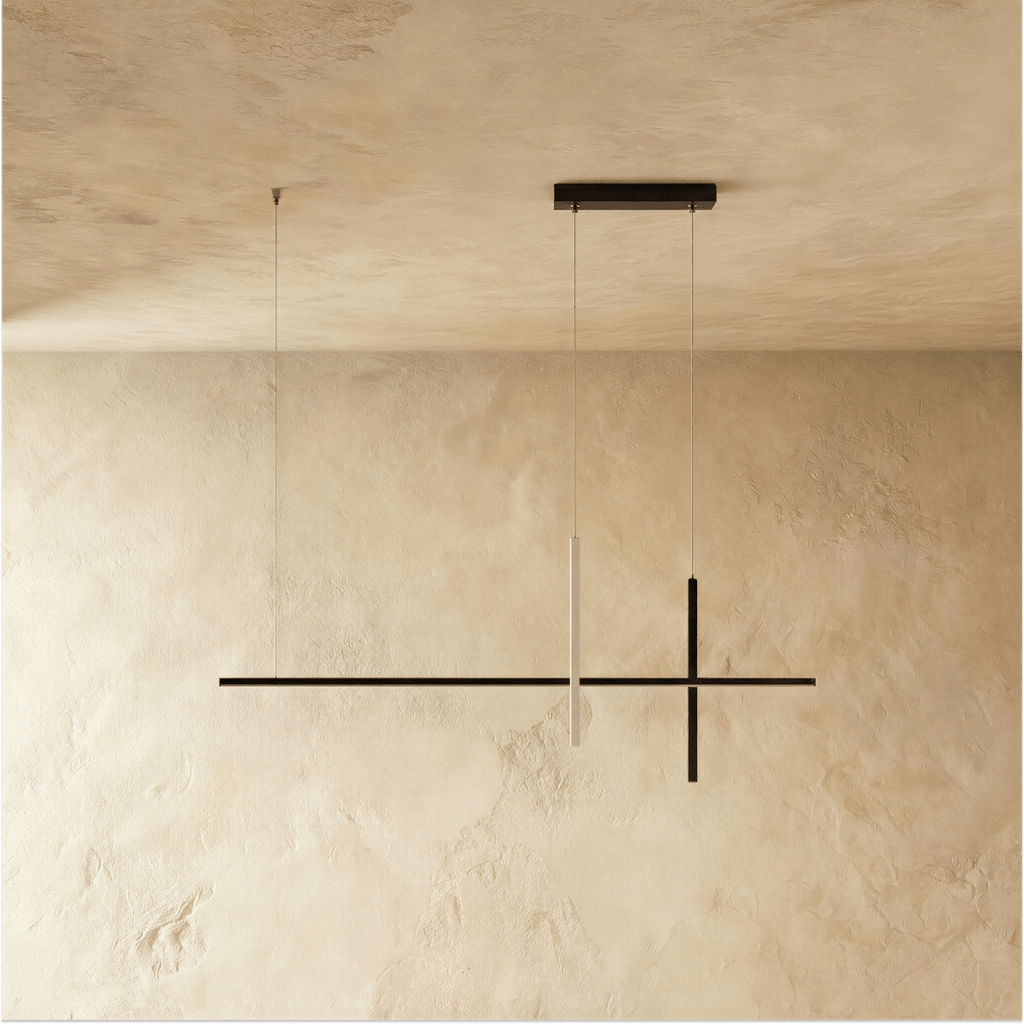 Clérachic pendant light in black, its cross-form linear bars suspended on fine cables from a slim ceiling canopy.
