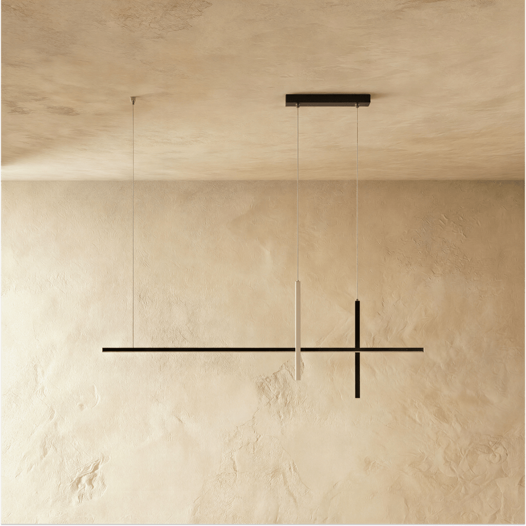 Clérachic pendant light in black, the glowing vertical bar set against its unlit horizontal and cross arms.