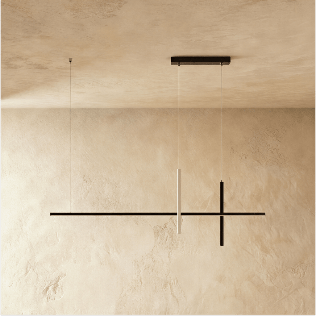 Clérachic pendant light in black, its slim crossing bars suspended against a plaster wall and ceiling.