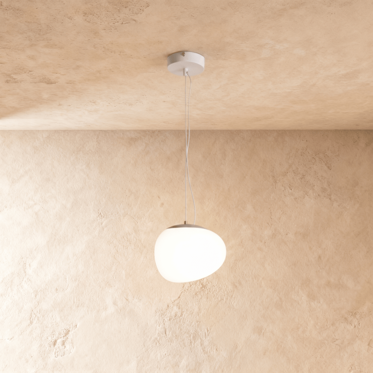 Clérachic pebble-shaped white pendant with a smooth frosted shade on two fine wires from a white round canopy