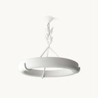 Clérachic ceiling light on a plain white backdrop, its low white plaster ring hung from a leaf stem with no ceiling rose.
