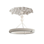 Clérachic ceiling light with its plaster ceiling rose on a white background, the ring hung below on three struts.
