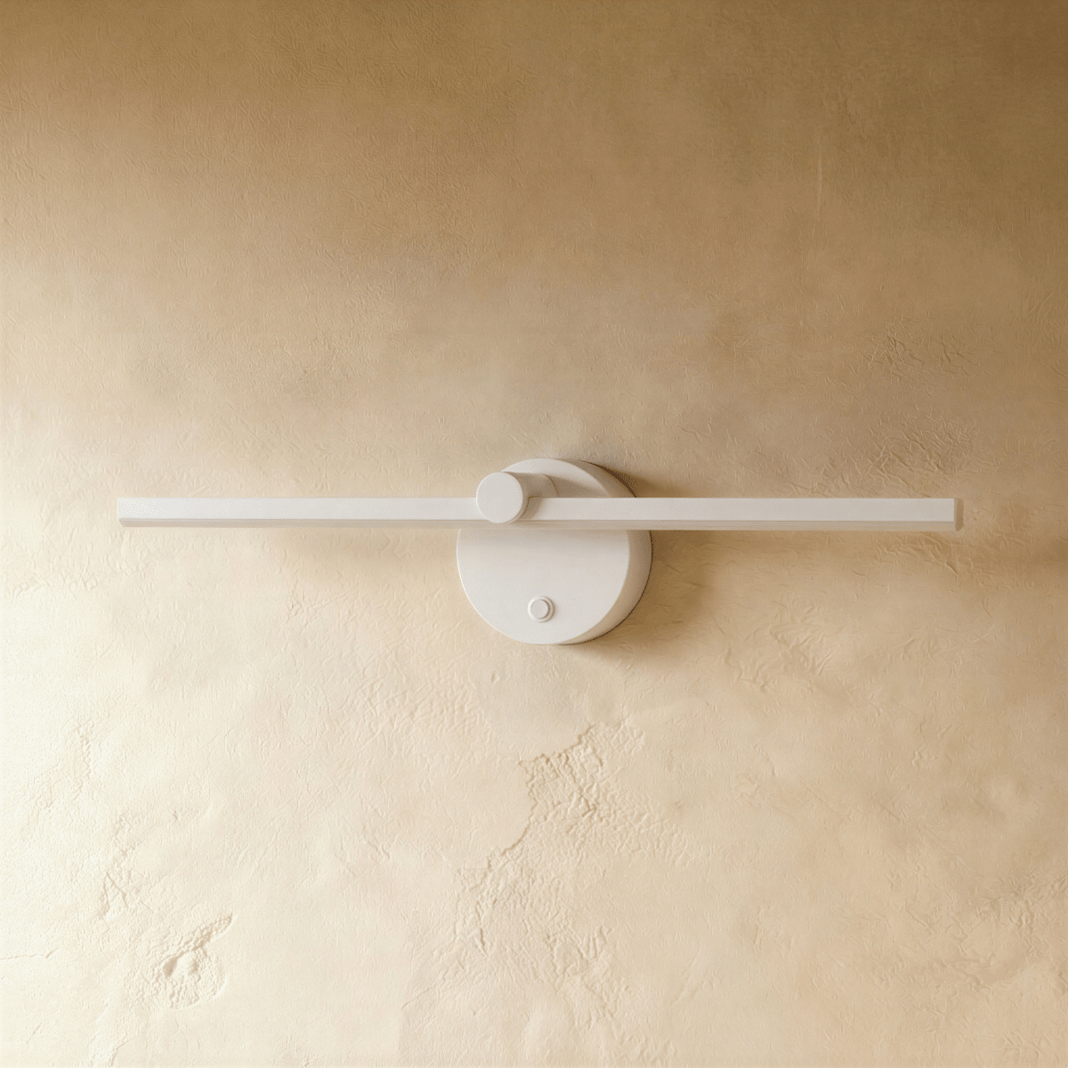 Clérachic wall lamp in white, the slender bar and round backplate shown unlit against a plaster wall.