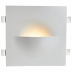 Clérachic trimless wall light shown front-on, lit, with its square plate and side mounting clips.