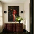 Clérachic's black wall lights frame an abstract canvas in a sunlit hallway beside a ribbed wood console table.
