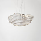 A Clérachic pendant with a compact ruffled mesh shade, unlit on a light grey backdrop.
