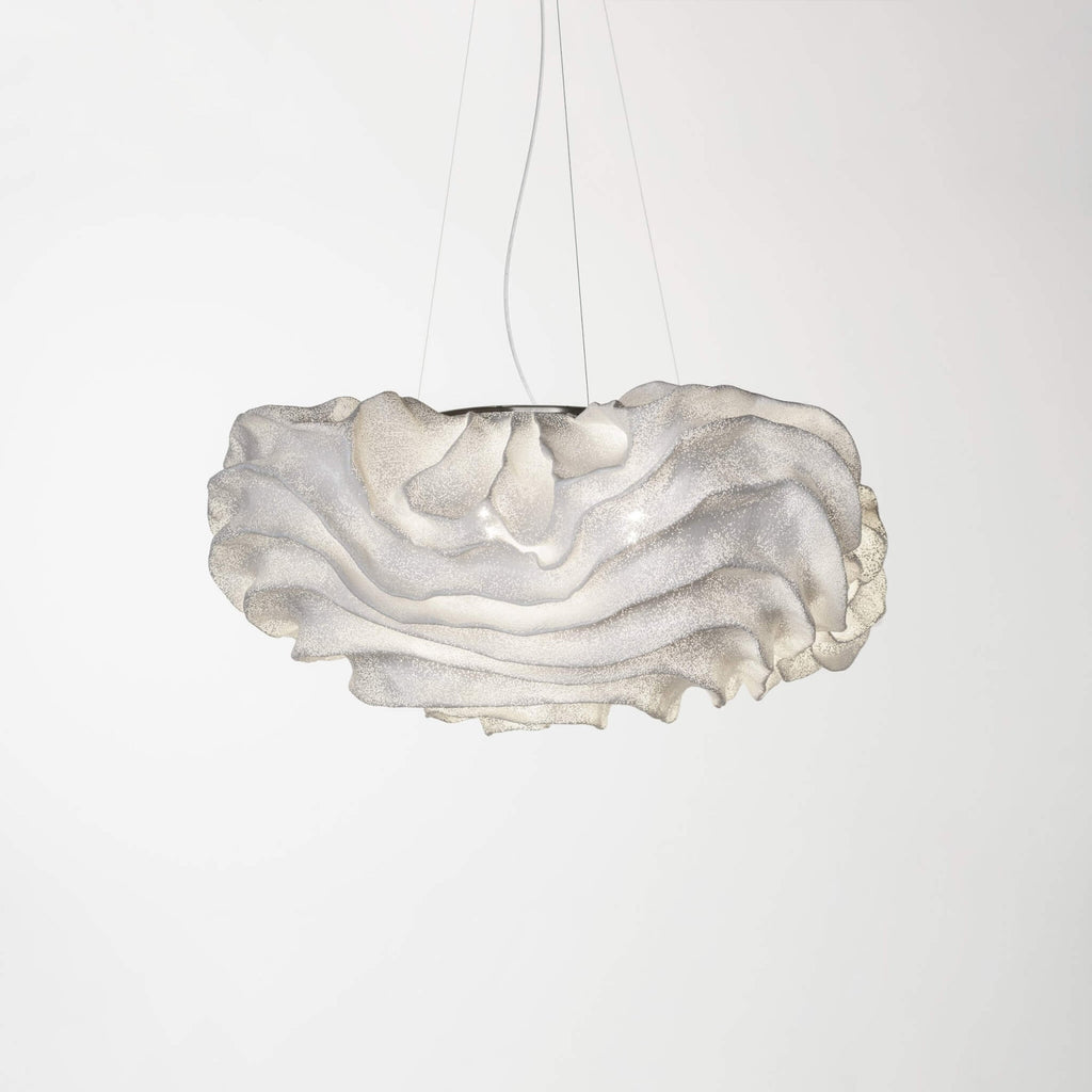 A Clérachic pendant with a layered white shade, a little wider than the last, on a light grey backdrop.