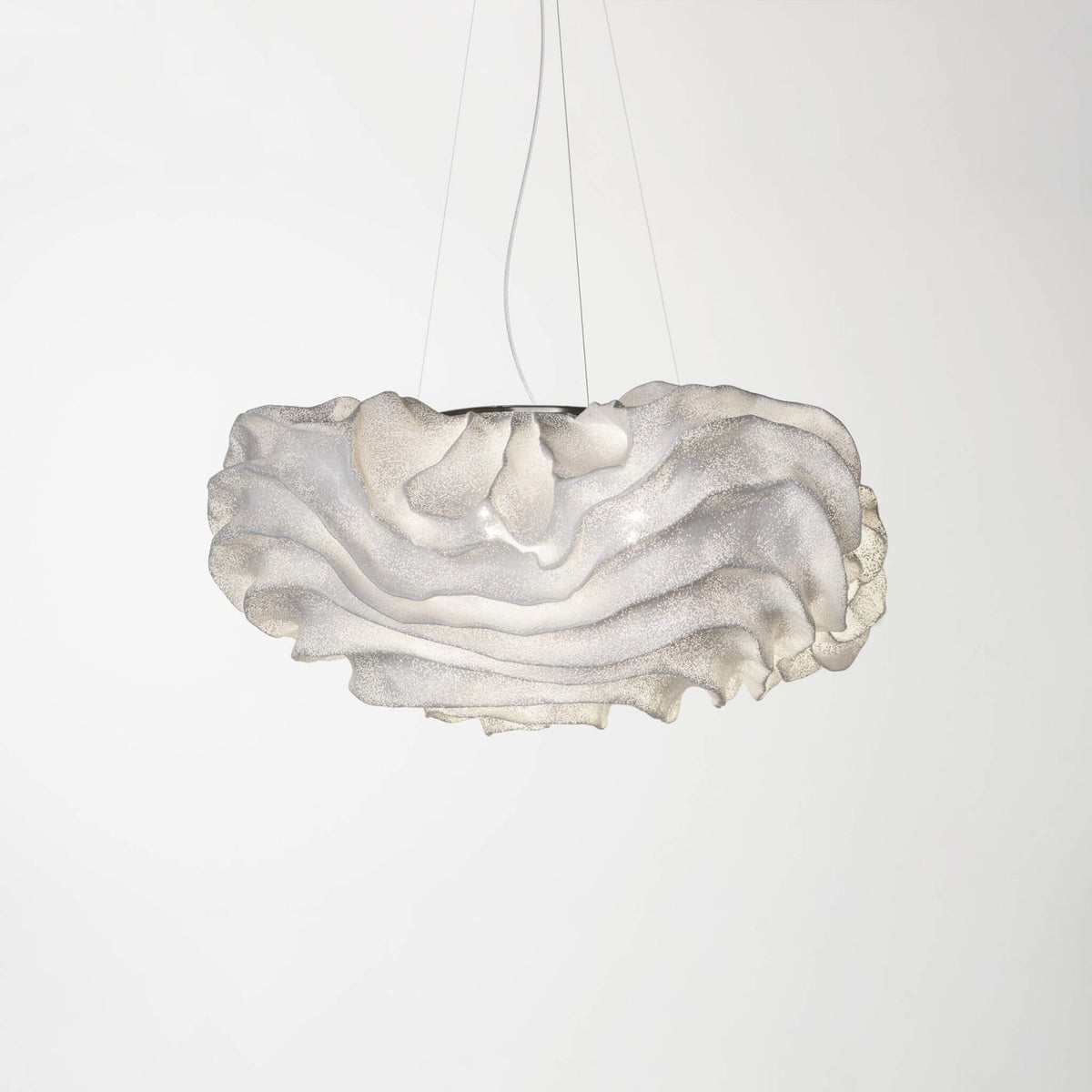 A Clérachic pendant with a layered white shade, a little wider than the last, on a light grey backdrop.