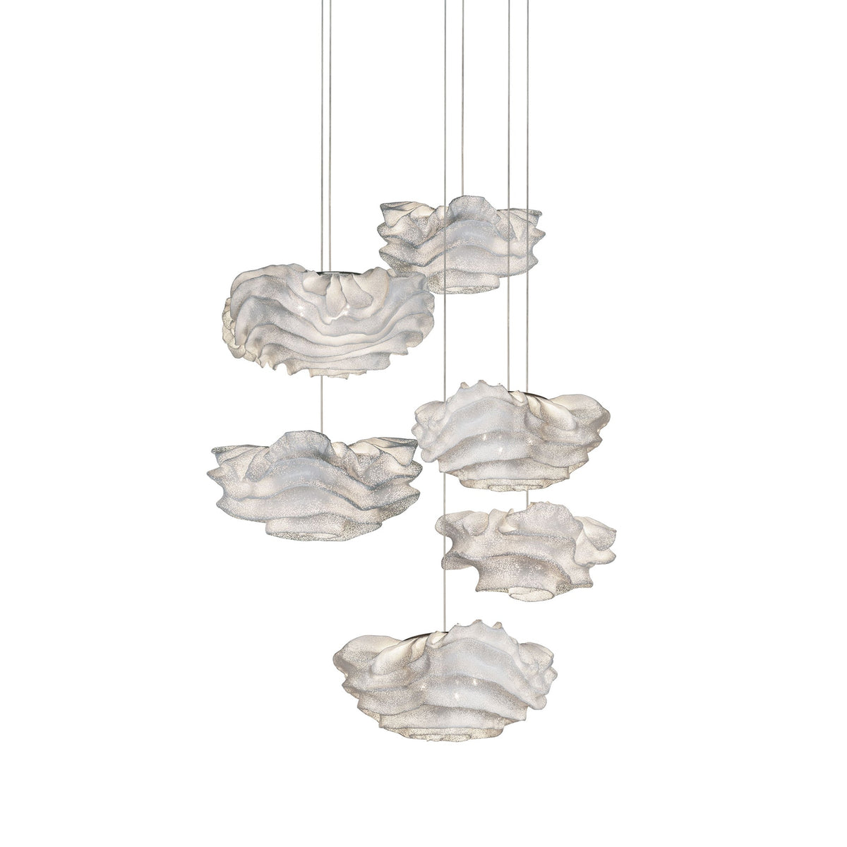 A cluster of six Clérachic pendants hung at different heights on white, each with a ruffled white mesh shade.