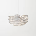 A compact Clérachic pendant with a layered, frilled shade on one cord, against a soft white backdrop.