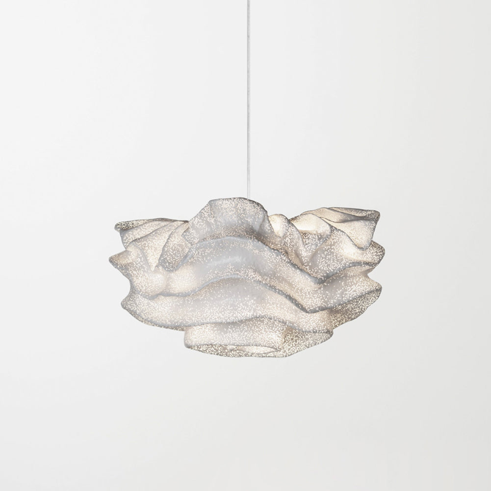 A compact Clérachic pendant with a layered, frilled shade on one cord, against a soft white backdrop.