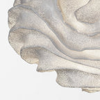 Close view of the flowing, wave-like folds on this Clérachic pendant shade, with pinprick perforations along each layer.