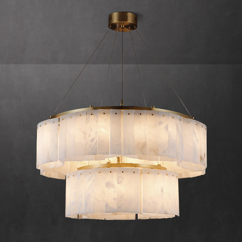 Clérachic's two-tier Willamette Alabaster Drum Chandelier, a smaller alabaster ring stacked under the main brass drum.
