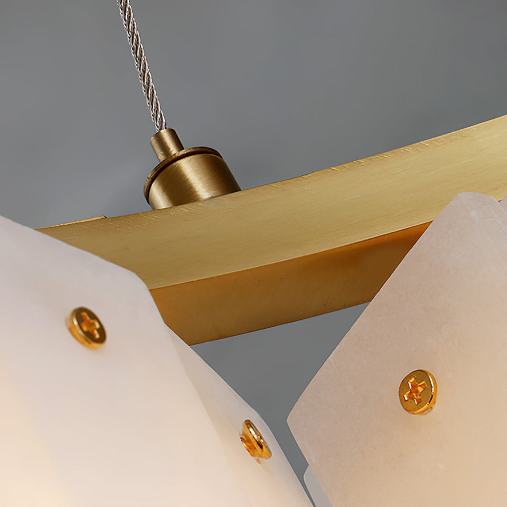 Detail of the Clérachic Willamette Alabaster Drum Chandelier, each stone panel pinned to the brass bar by one gold screw.