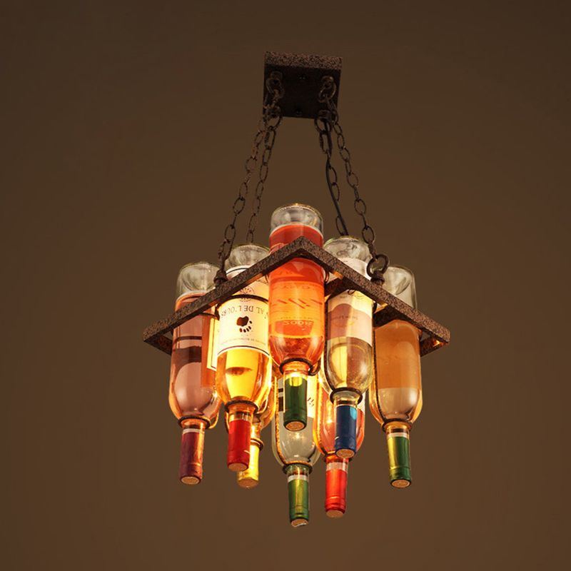 The Clérachic wine bottle chandelier in its compact peaked-frame style, full bottles clustered beneath a rust-toned metal cap.