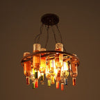 The Clérachic wine bottle chandelier in its large round-frame style, multi-colour glass shades ringing a wide antique metal hoop while lit.