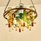 Close-up of the Clérachic wine bottle chandelier's round frame, showing labelled glass bottles and warm bulbs glowing against a plain wall.