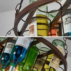 Close-up pair showing the Clérachic wine bottle chandelier's hammered metal ring and coloured glass bottles, labels in blue, green, and yellow.